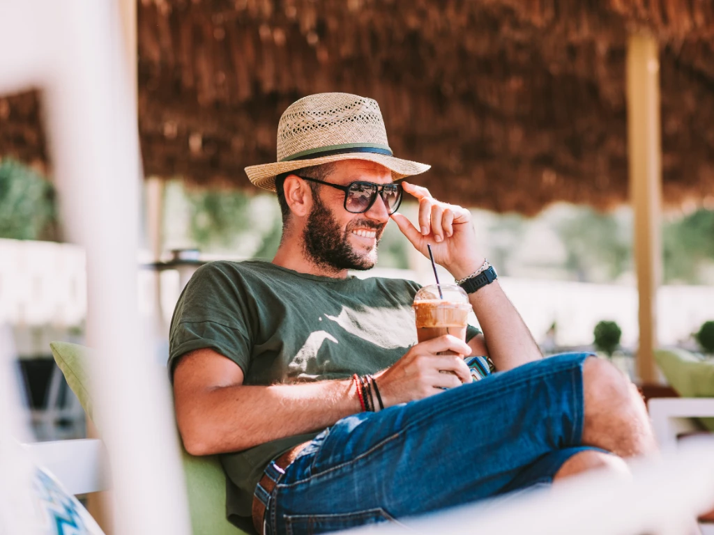 Man drinking iced coffee.jpg